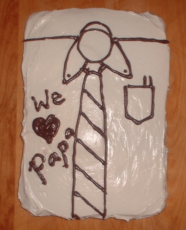 Photo: A cake decorated to resemble a shirt with a necktie and with pens in the pocket.
