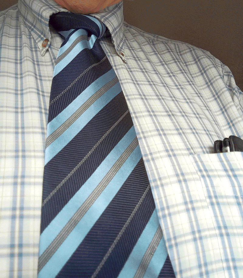 Photo: Shirt with tie and with pen in pocket.