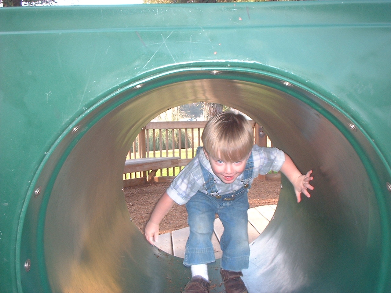 child playing on playground structure [IMG]